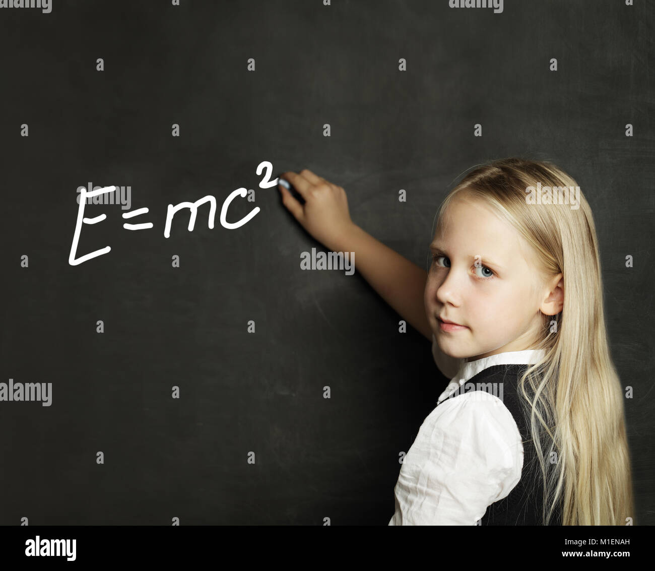 Schoolgirl Studies Science. Child on Blackboard Background Stock Photo Alamy