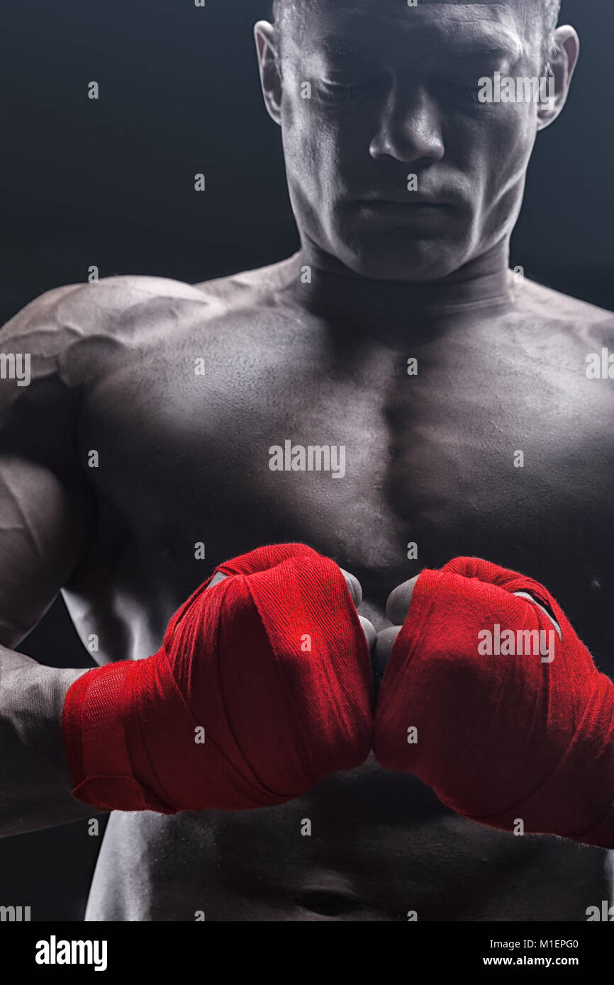 Boxing man ready to fight. Boxer with strong hands and clenched fists