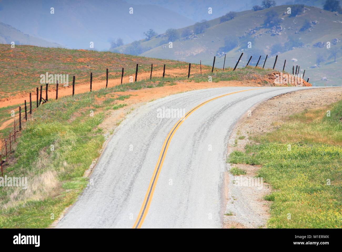 California, United States - winding road in countryside landscape of Tulare County. Stock Photo