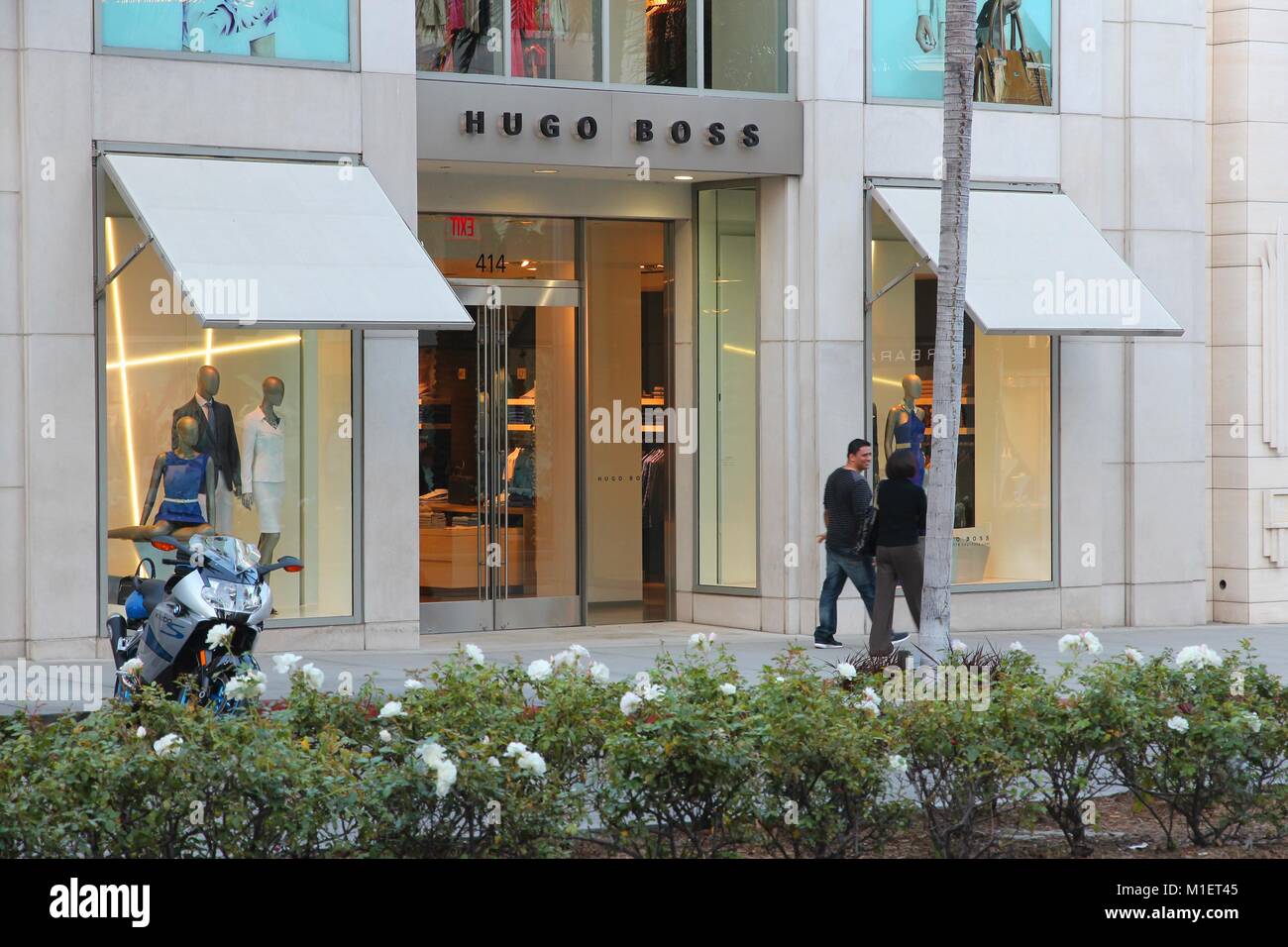 LOS ANGELES, USA - APRIL 5, 2014: Shoppers visit Hugo Boss store in Beverly Hills, Los Angeles. Hugo Boss is a German luxury fashion house 263 million Stock Photo