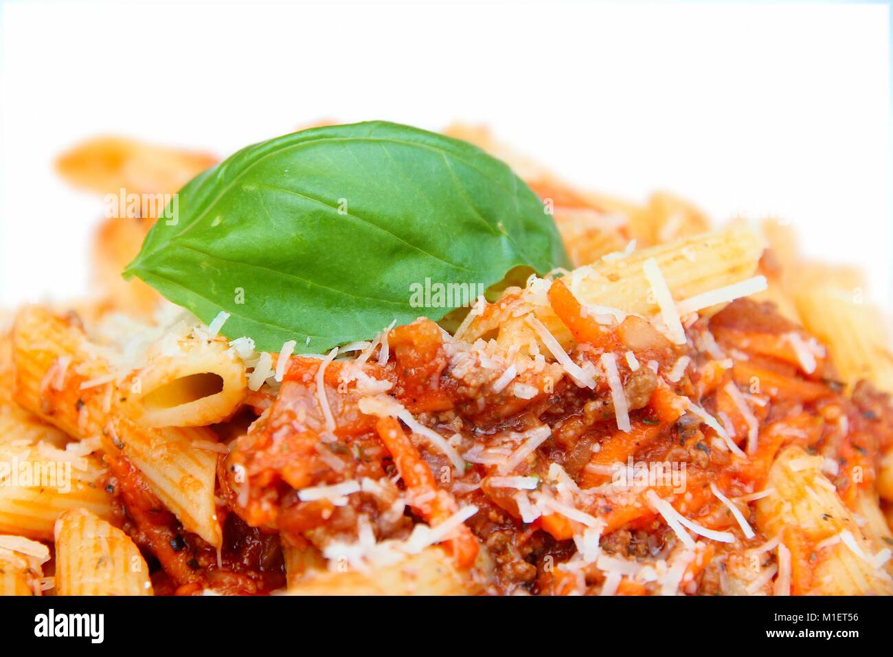 Pasta plate in a restaurant penne with tomato sauce, minced meat
