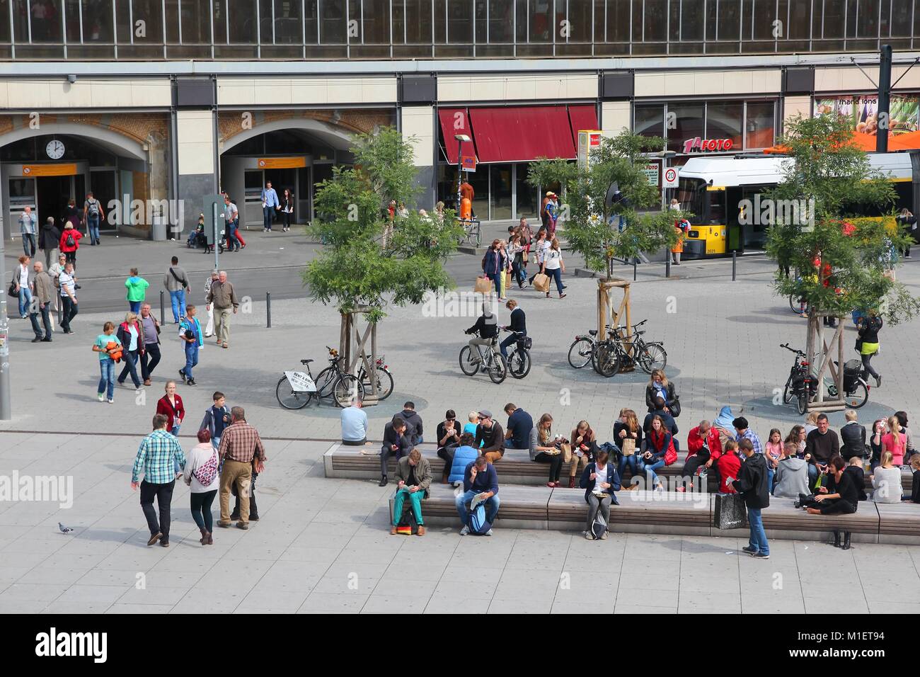BERLIN, GERMANY - AUGUST 26, 2014: People visit famous Alexander Square (Alexanderplatz) in Berlin. Berlin is Germany's largest city with population o Stock Photo