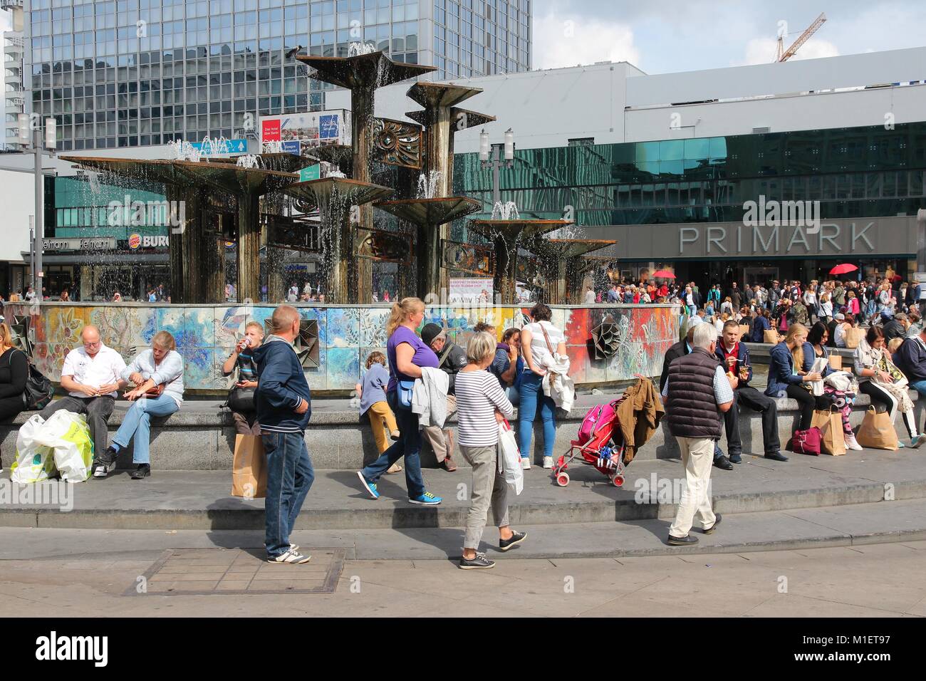 BERLIN, GERMANY - AUGUST 26, 2014: People visit famous Alexander Square (Alexanderplatz) in Berlin. Berlin is Germany's largest city with population o Stock Photo