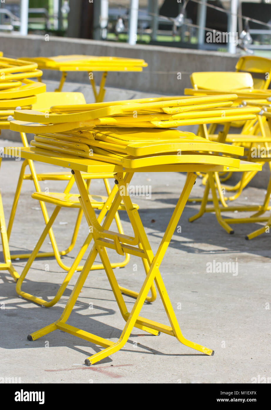 Yellow fold tables and chairs Stock Photo Alamy