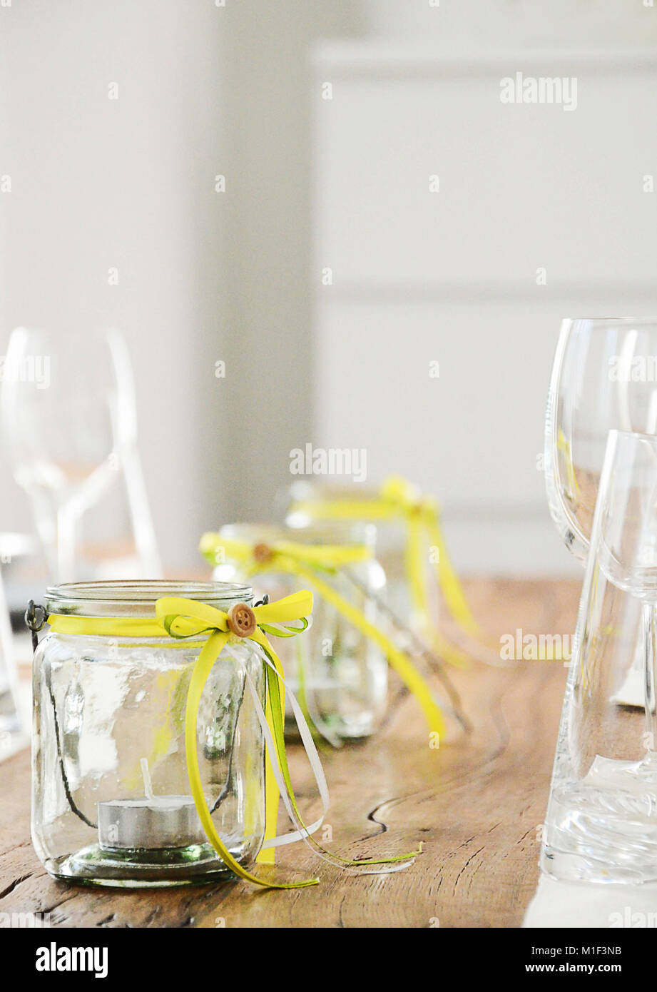 Glass Jar With Tea Candles Inside Table Decoration In Yellow And