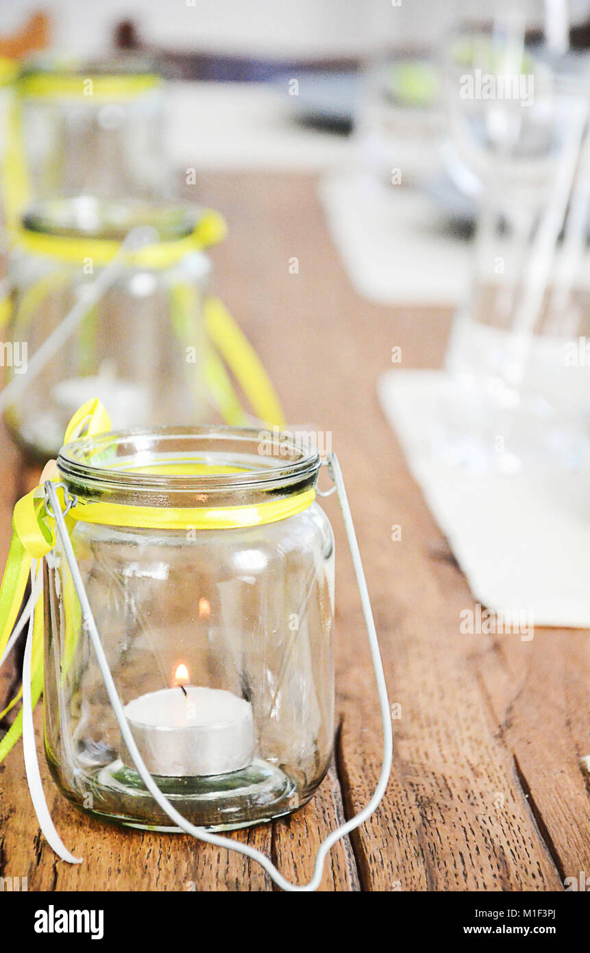 Glass Jar With Tea Candles Inside Table Decoration In Yellow And