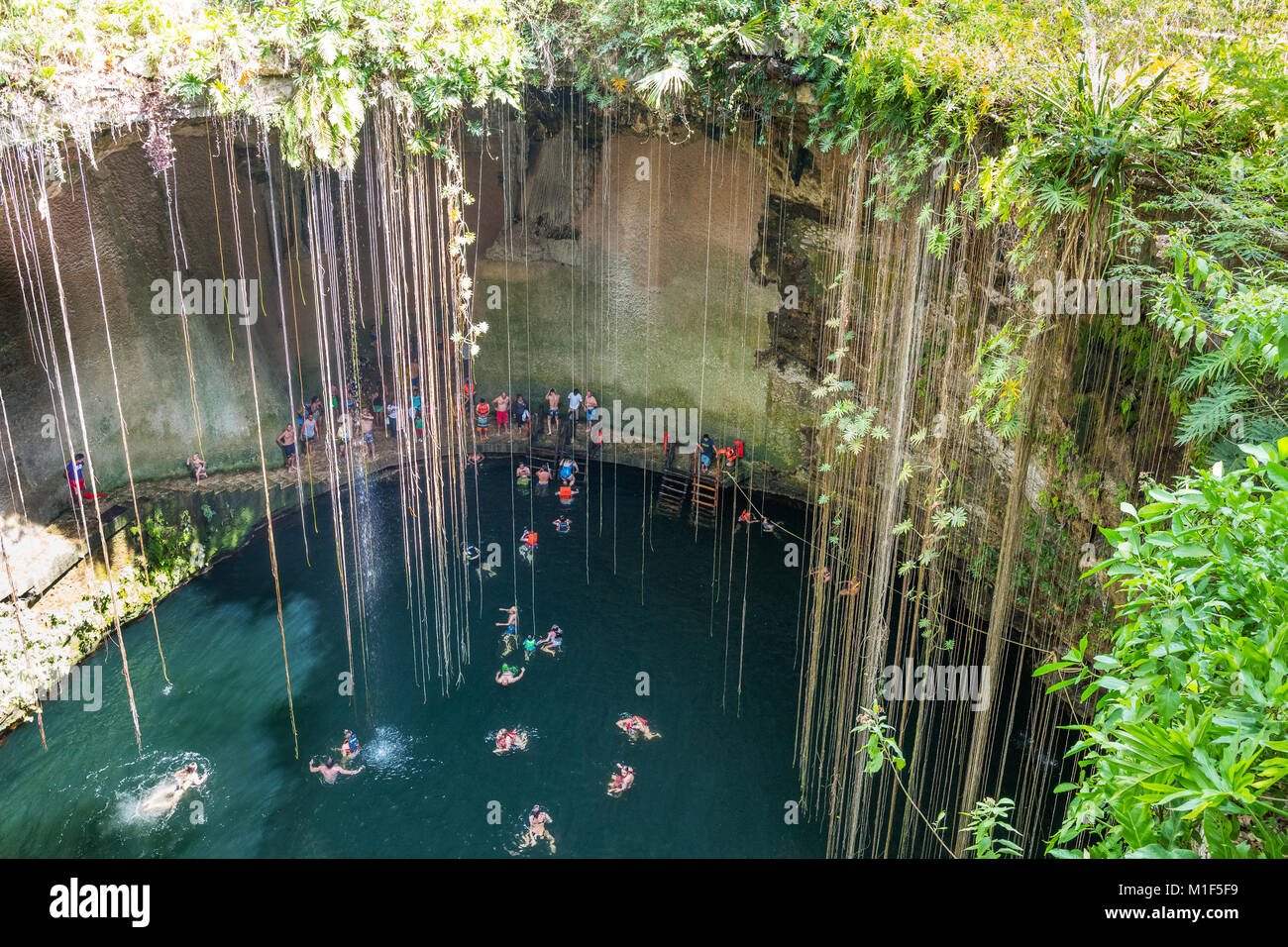 Chichen Itza Mexico Tourists Bathing In The Ik Kil