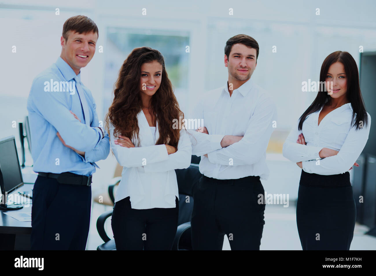 group of businesspeople standing together in office Stock Photo - Alamy