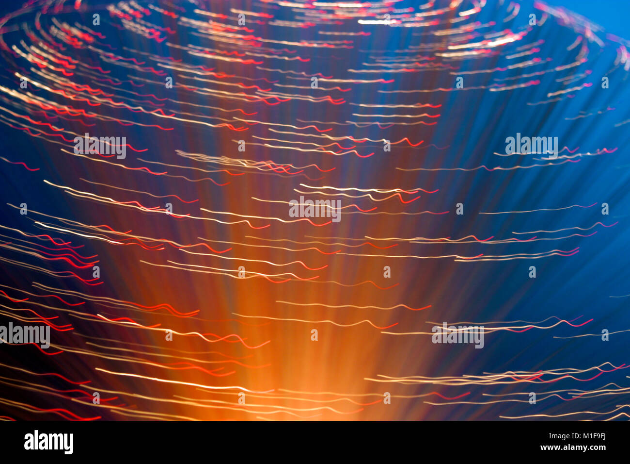 Fibre optic lamps, multi-coloured abstract on blue background Stock Photo