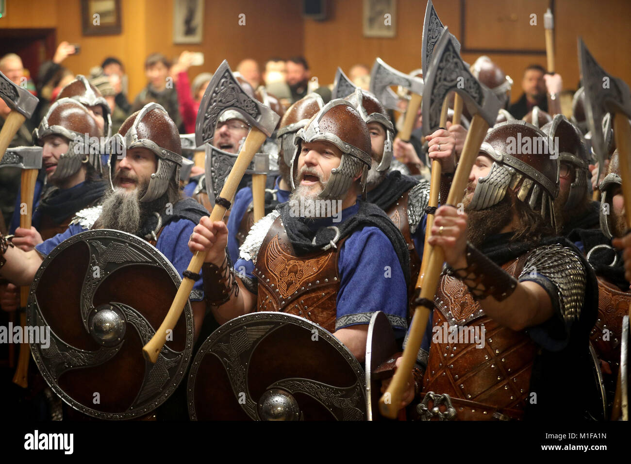 Members of the Jarl Squad dressed in Viking suits singing in the Royal