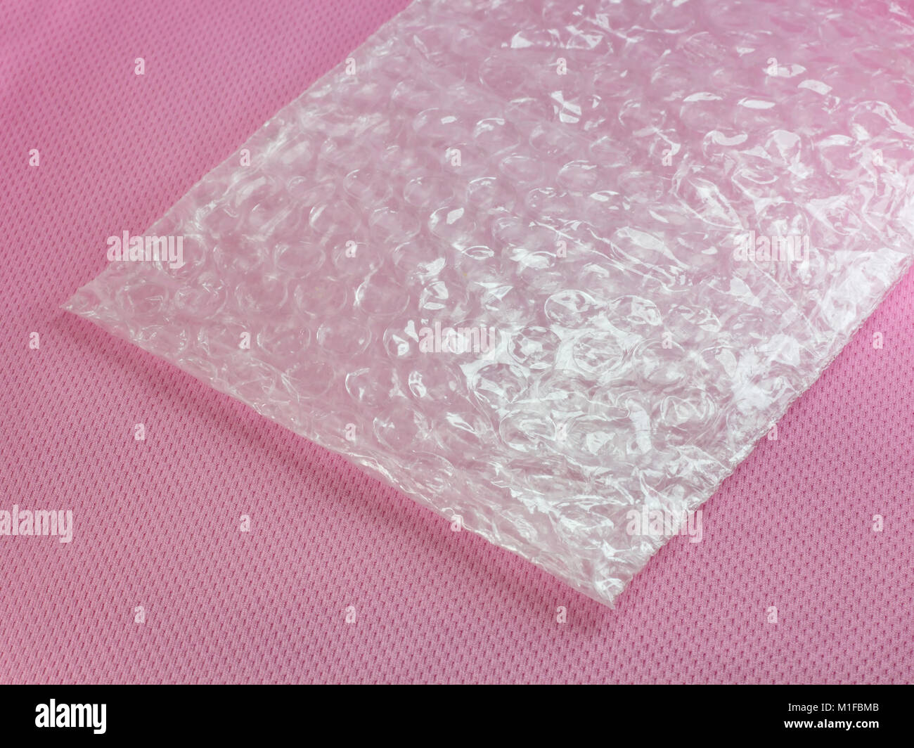 Shockproof material - Air Bubble Sheet on pink background Stock Photo