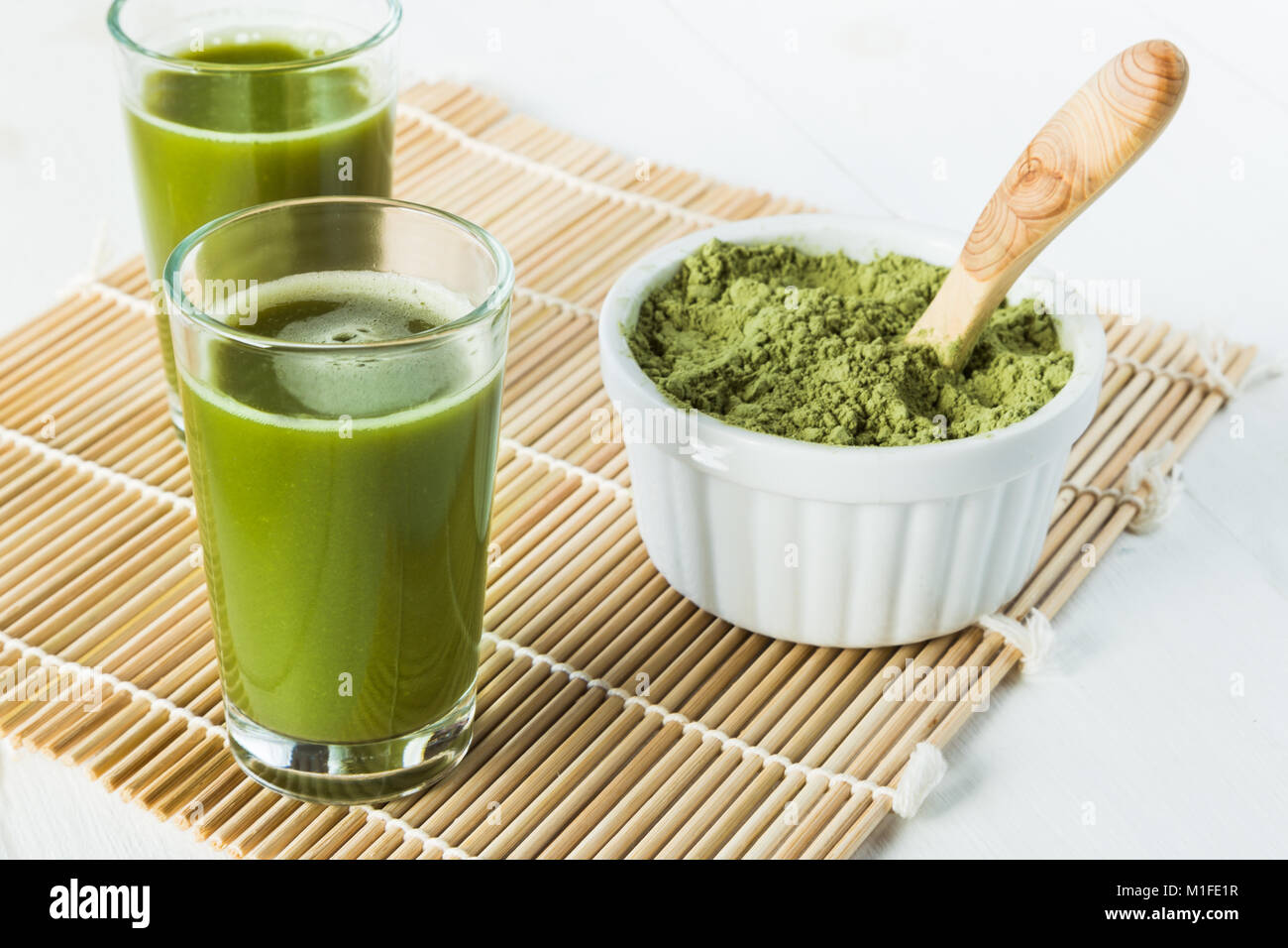 Wheatgrass juice shots in small glasses Stock Photo Alamy