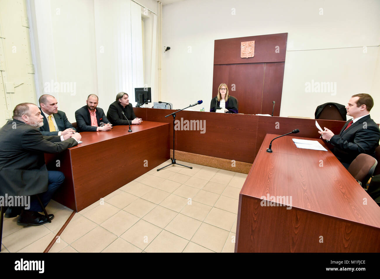 Kidnapped Czechs L-R Jan Svarc, Miroslav Dobes, Adam Homsi and Pavel Kofron are seen during the court hearing in Prague, Czech Republic, on Tuesday, January 30, 2018. In the center of the photo is seen judge Edita Votockova. The Czechs who were kidnapped in Lebanon in 2015 have no right to a compensation worth 40 million crowns, as a court dismissed today their complaint about the state's failure to prevent the abduction and said it found no mistake on the part of state bodies. The verdict is not definitive and can be appealed. (CTK Photo/Vit Simanek) Stock Photo
