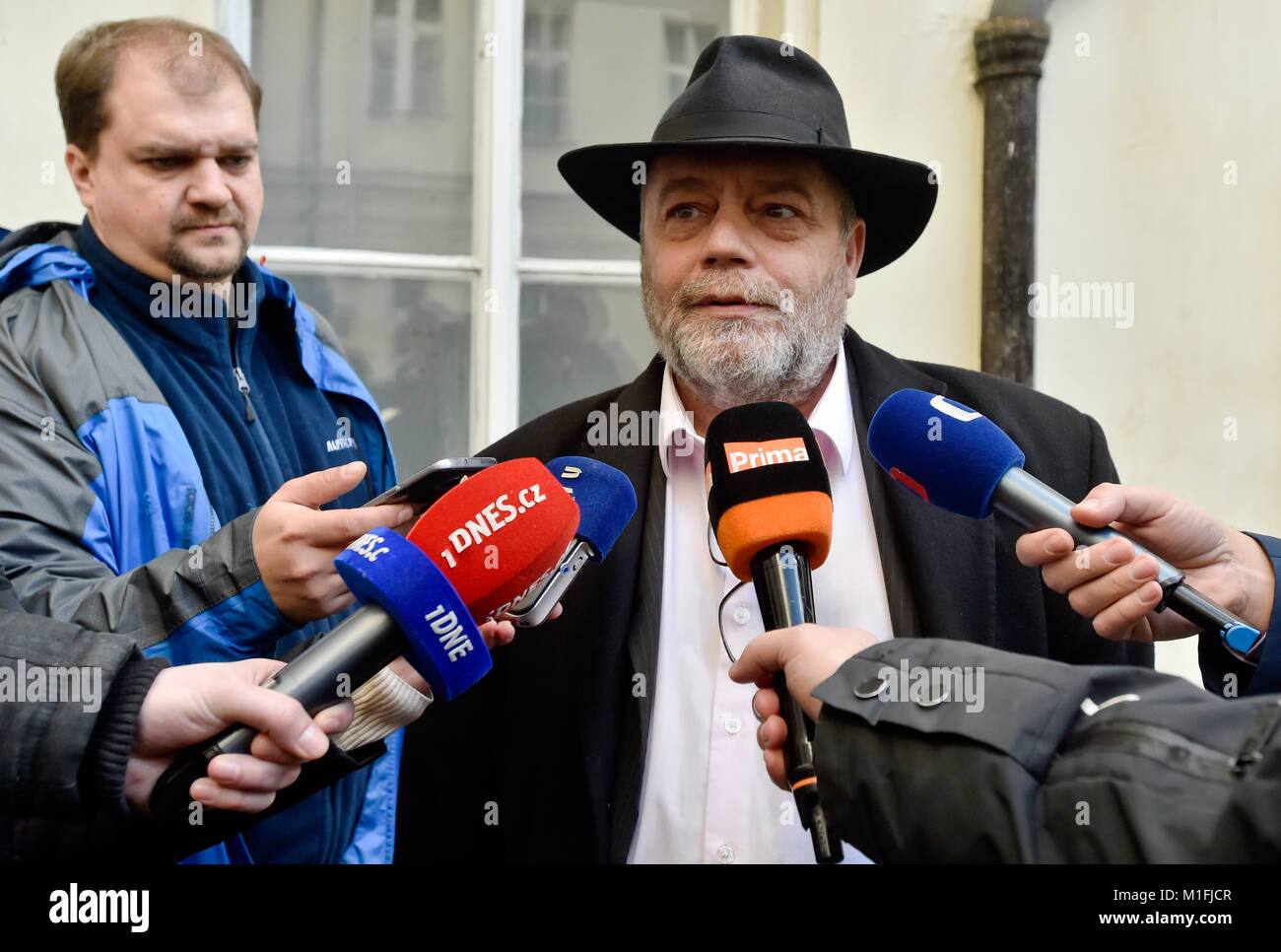 Prague, Czech Republic. 30th Jan, 2018. Jan Svarc (right), one of kidnapped Czechs, speaks to journalists after hearing in Prague, Czech Republic, on Tuesday, January 30, 2018. The Czechs who were kidnapped in Lebanon in 2015 have no right to a compensation worth 40 million crowns, as a court dismissed today their complaint about the state's failure to prevent the abduction and said it found no mistake on the part of state bodies. The verdict is not definitive and can be appealed. Credit: Vit Simanek/CTK Photo/Alamy Live News Stock Photo