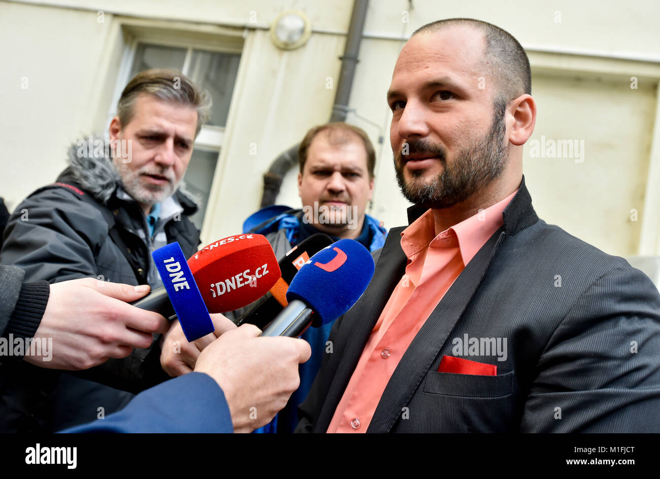 Prague, Czech Republic. 30th Jan, 2018. Adam Homsi (right), one of kidnapped Czechs, speaks to journalists after hearing in Prague, Czech Republic, on Tuesday, January 30, 2018. The Czechs who were kidnapped in Lebanon in 2015 have no right to a compensation worth 40 million crowns, as a court dismissed today their complaint about the state's failure to prevent the abduction and said it found no mistake on the part of state bodies. The verdict is not definitive and can be appealed. Credit: Vit Simanek/CTK Photo/Alamy Live News Stock Photo