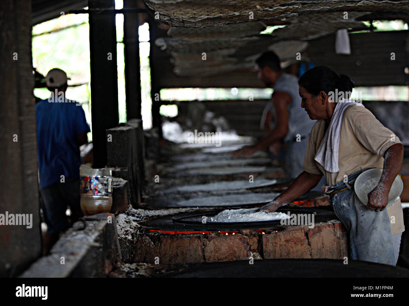 December 8, 2012 - Maturin, Monagas, Venezuela - december 09, 2012.  Tenderers start the cooking of the cakes in the budares.The casabe or cazabe is part of the tradition of the Venezuelan as its indigenous people elaborated it and it is known as the Venezuelan bread. In the city of Maturâ€™n, Monagas state. Venezuela .foto: Juan Carlos Hernandez (Credit Image: © Juan Carlos Hernandez via ZUMA Wire) Stock Photo