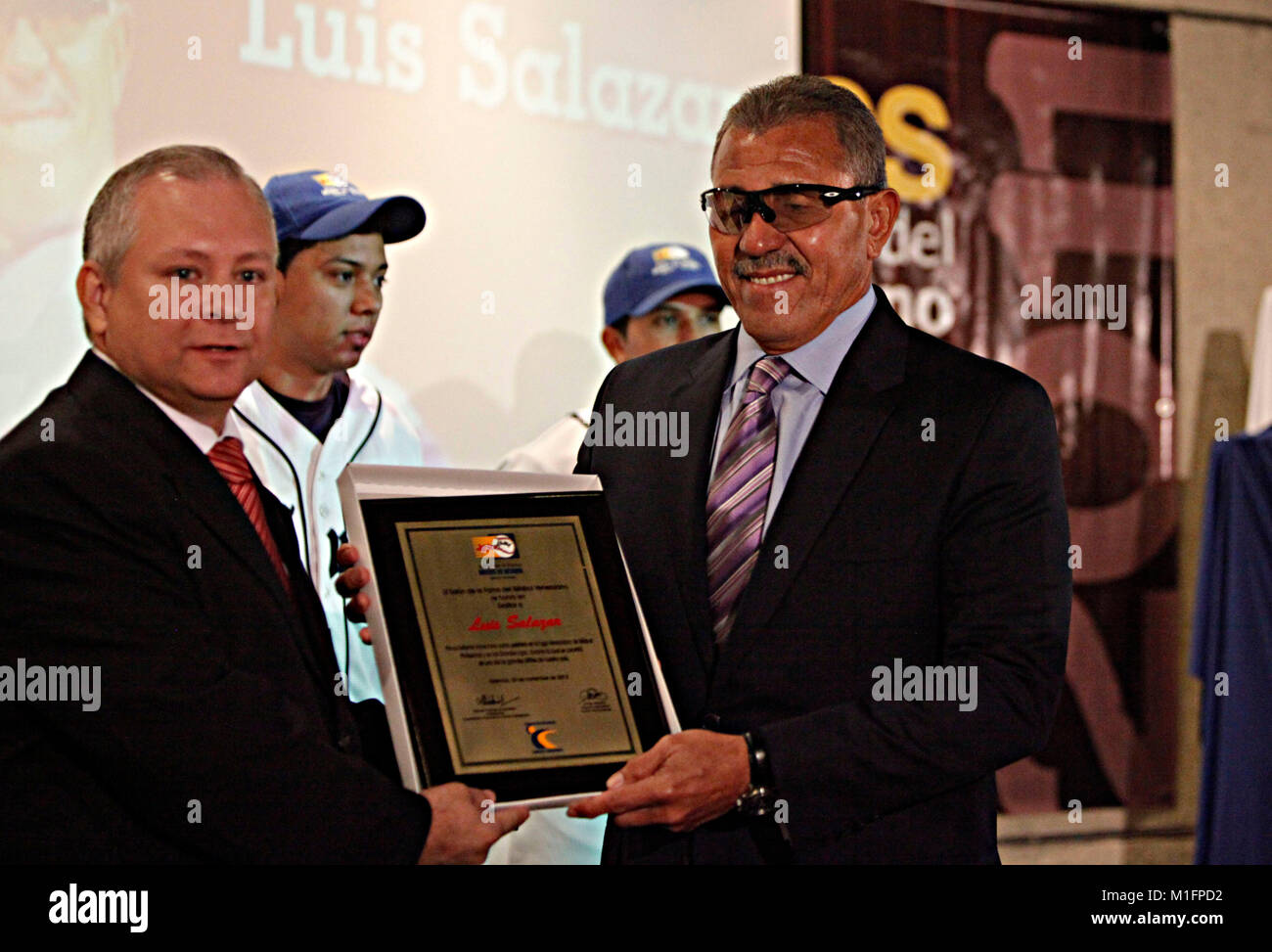 Naguanagua, Carabobo, Venezuela. 20th Nov, 2012. November 20, 2012. Luis Salazar (R) receives a plaque of recognition from the hands of Giner Garc'a (L) during the ceremony of exaltation to the hall of fame of Venezuelan baseball, at the headquarters of the baseball museum. Luis Salazar played for 13 seasons in the big leagues for organizations like San Diego, White Sox, Detroit and the Cubs. Photo: Juan Carlos Hernandez Credit: Juan Carlos Hernandez/ZUMA Wire/Alamy Live News Stock Photo