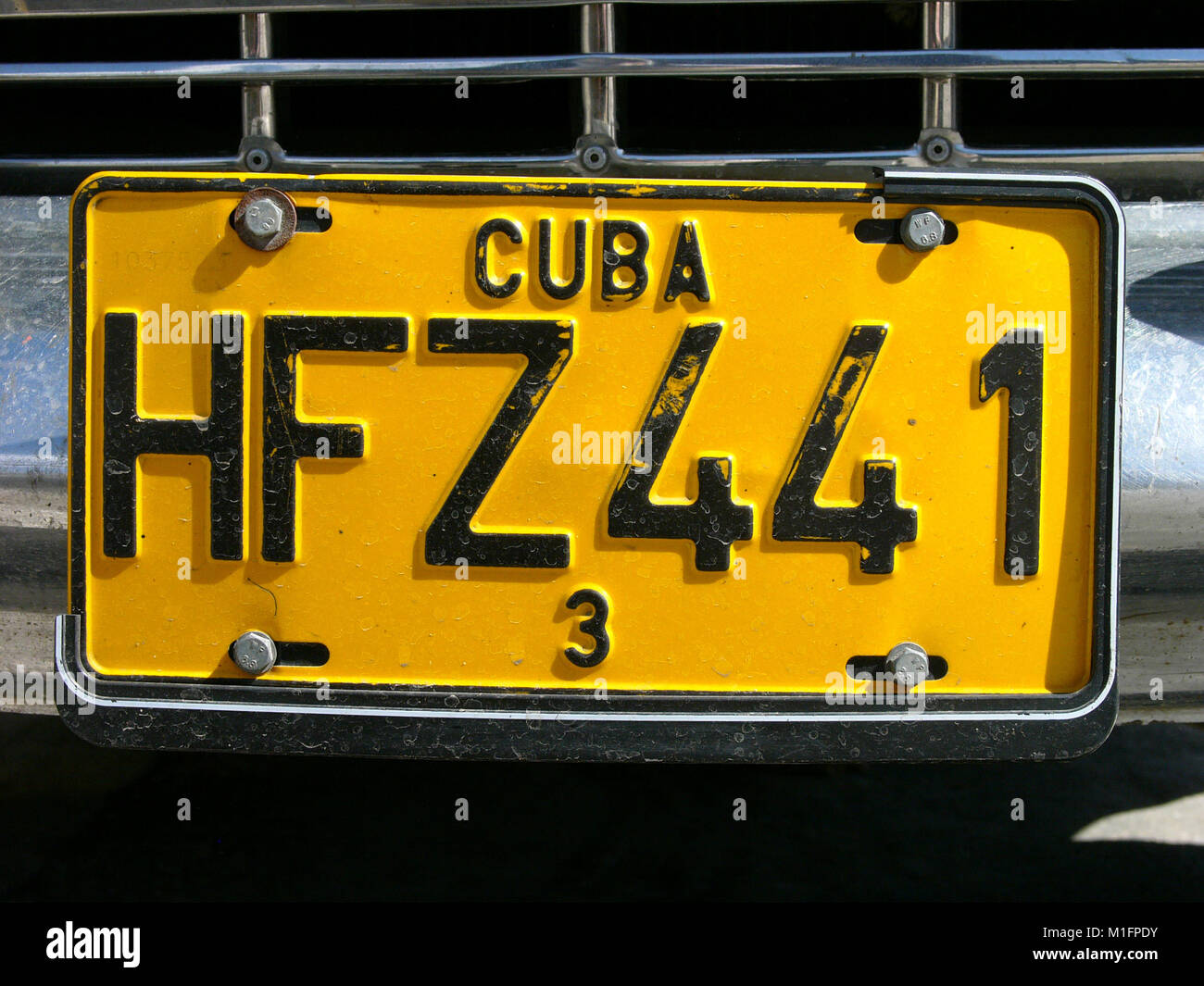 Mar 28, 2006 - Havana, CUBA - One of many Cuban Maquinas, aka Yank tanks or pre 1960 American Classic cars with Cuban License plate, in the streets of Havana. One in eight cars in Cuba today is a pre-1960s American brand Ford, Chevrolet, Cadillac, Chrysler, Packard and other classic models. The Republic of Cuba is located in the northern Caribbean and south of the United States. The first European to visit Cuba was explorer Christopher Columbus in 1492. Centuries of colonial rule and revolutions followed. Batista was deposed by Fidel Castro and Che guevara in 1953. After the revolution trade w Stock Photo