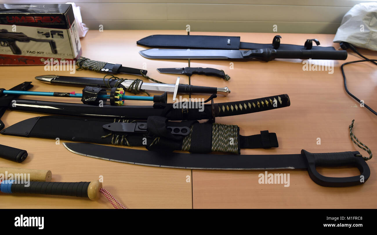 Krefeld, Germany. 30th Jan, 2018. Seized swords and knives lying on a table at a press conference in Krefeld, Germany, 30 January 2018. In the morning of 30 January, special forces from customs and police have taken part in a raid against organized illegal labour and have secured weapons and other objects. Credit: Caroline Seidel/dpa/Alamy Live News Stock Photo