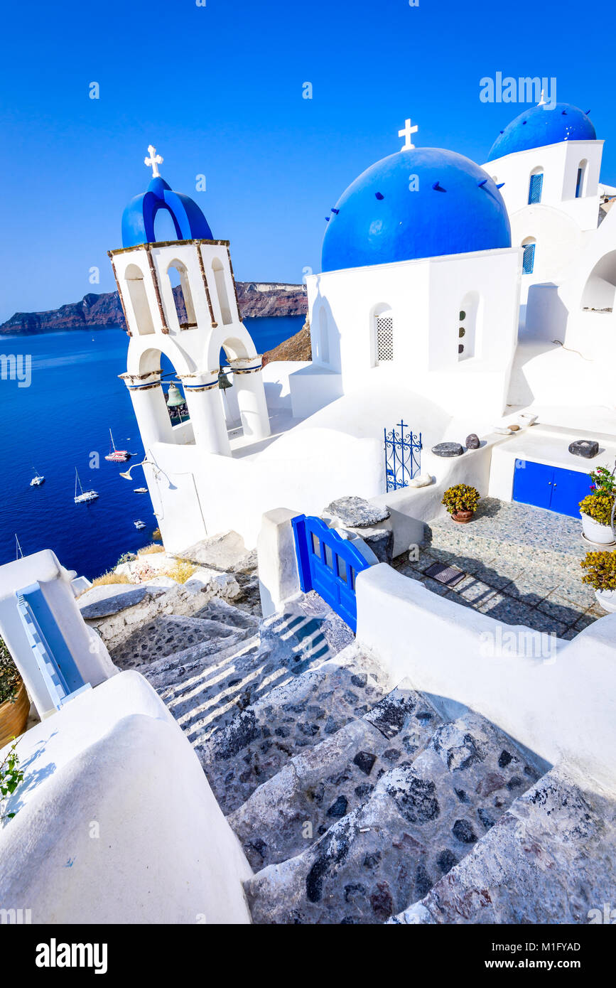 Oia, Santorini - Greece. Famous attraction of white village with cobbled streets, Greek Cyclades Islands, Aegean Sea. Stock Photo