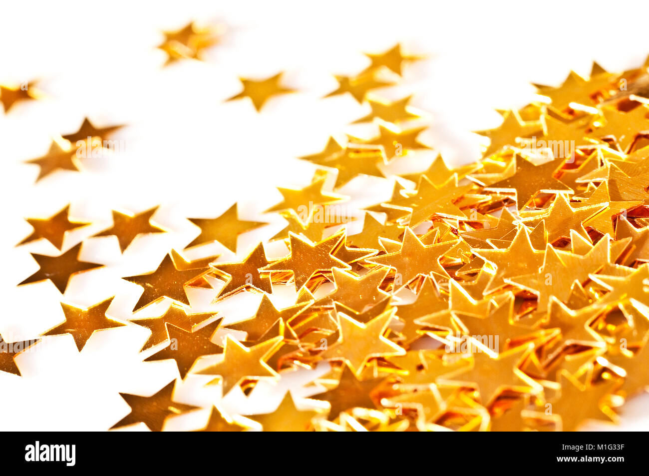 Close up of golden stars on a white background Stock Photo - Alamy