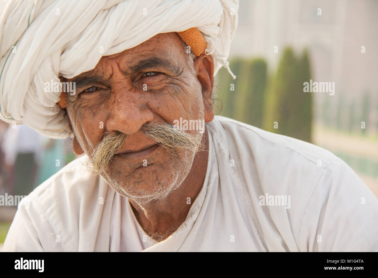 Old Indian man in turban with grey / gray moustache at the Taj Mahal, Agra, Utter Pradesh, India Stock Photo