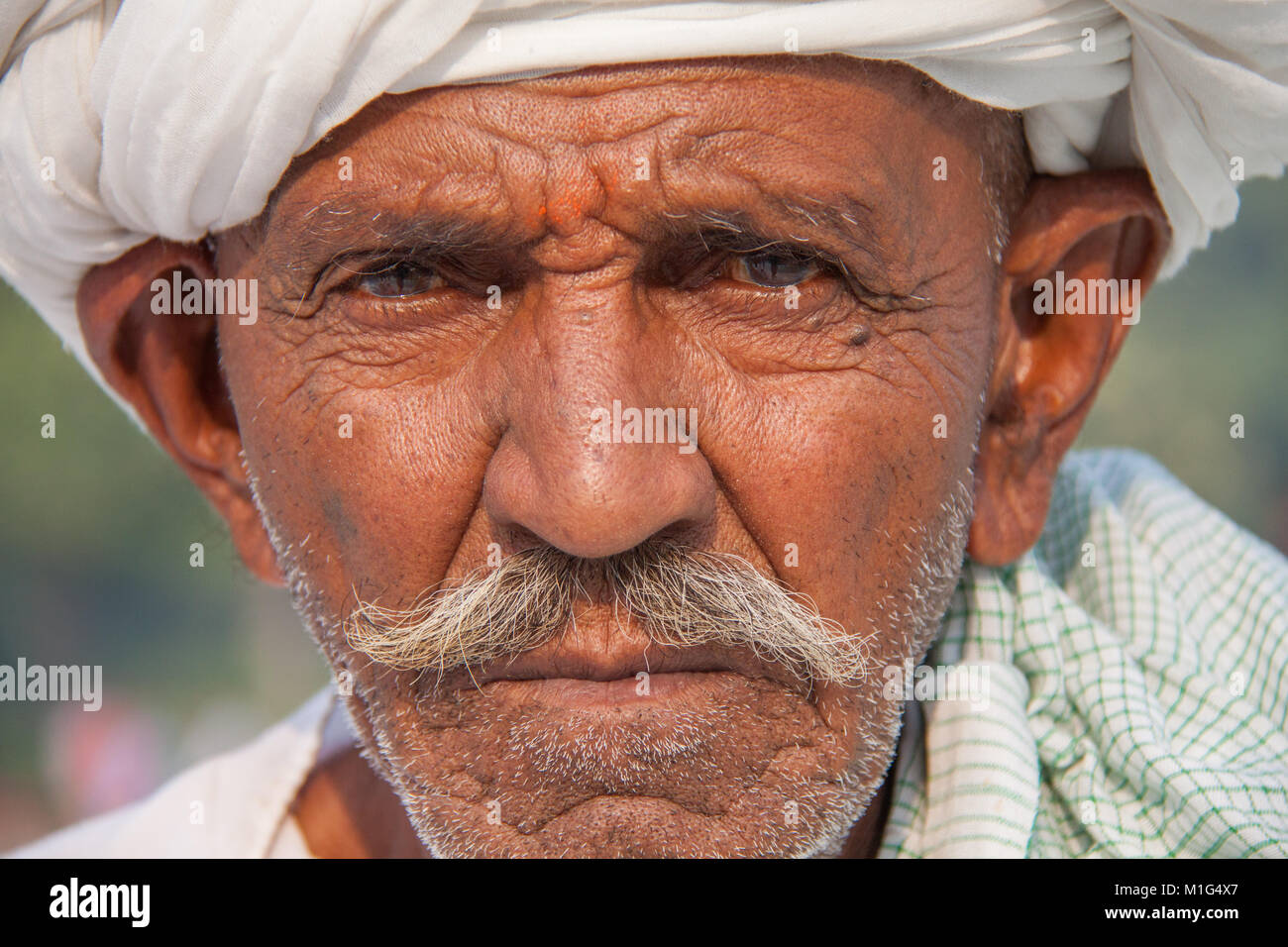 Old Indian man in turban with grey / gray moustache at the Taj Mahal, Agra, Utter Pradesh, India Stock Photo