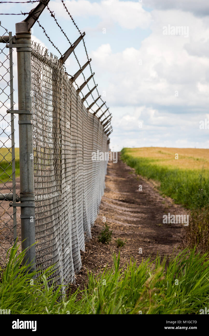Barb wire security fence Stock Photo