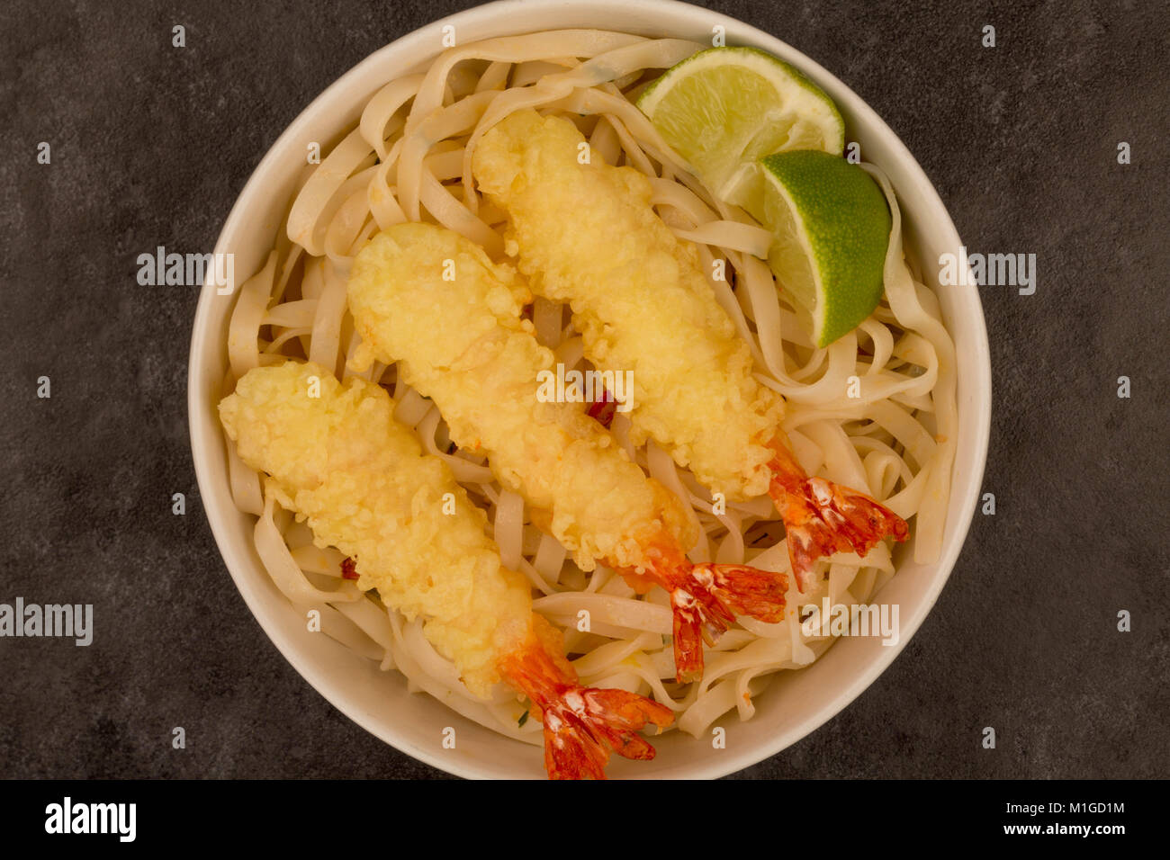 Japanese Style Deep Fried Prawn Tempura With Noodles and Lime Against A