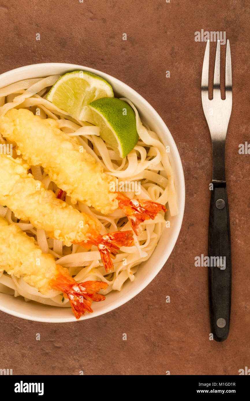 Japanese Style Deep Fried Prawn Tempura With Noodles and Lime Against A