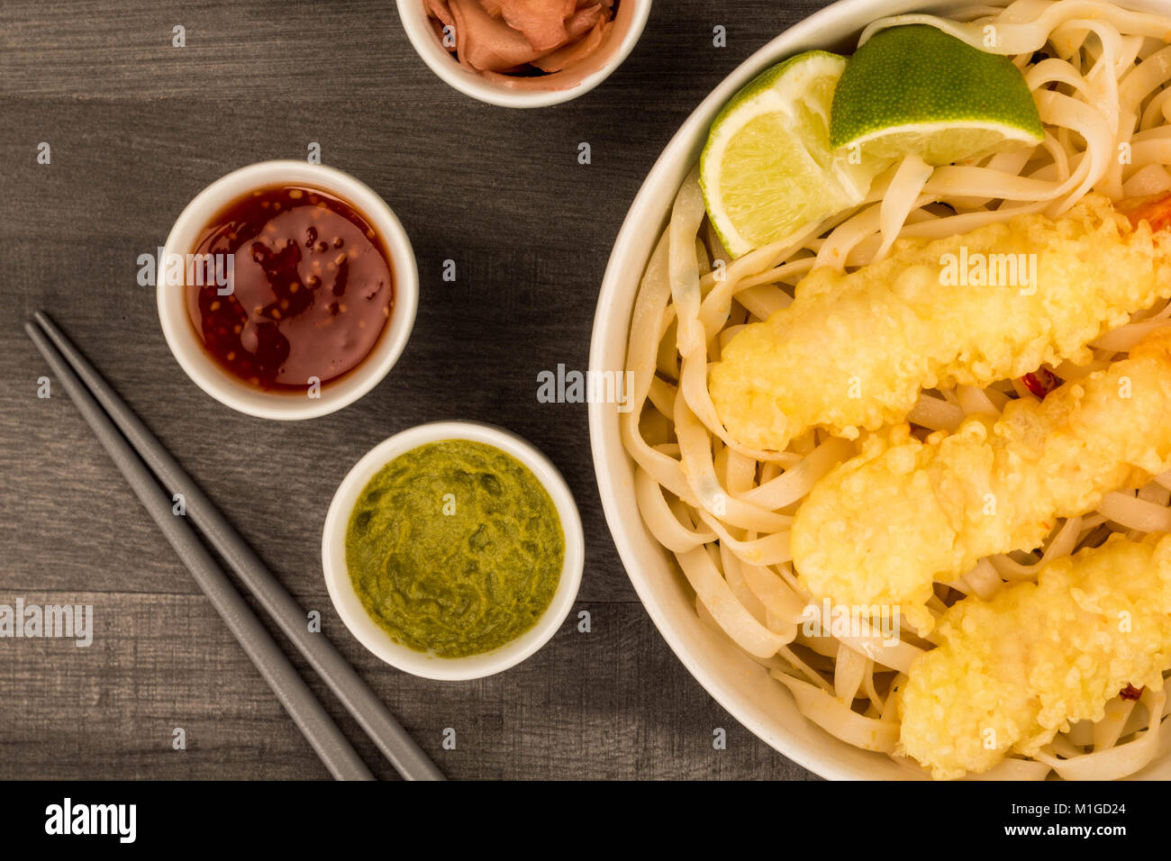 Japanese Style Deep Fried Prawn Tempura With Noodles and Lime Against A