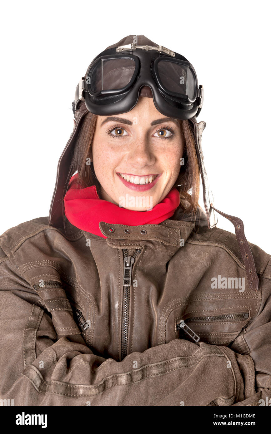 Funny girl with freckles wearing helmet, goggles and a red scarf Stock