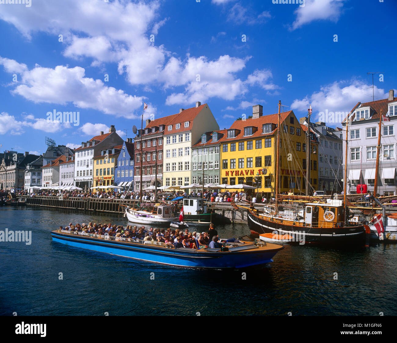 Tourists on pleasure boat, Nyhavn, Copenhagen, Denmark. Stock Photo