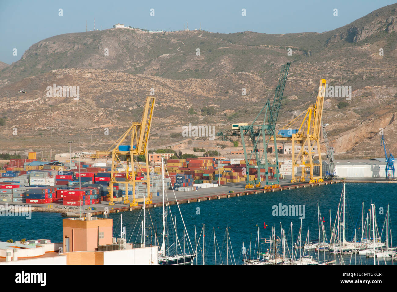 CARTAGENA, SPAIN - 28, 2016: Commercial cranes & shipping containers in the port of Cartagena Stock Photo