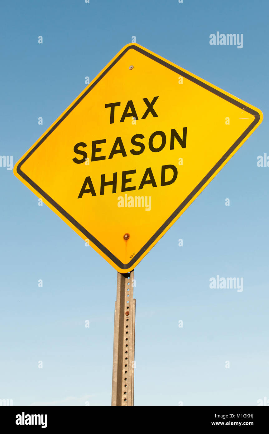 Road sign announcing that tax season is ahead Stock Photo Alamy