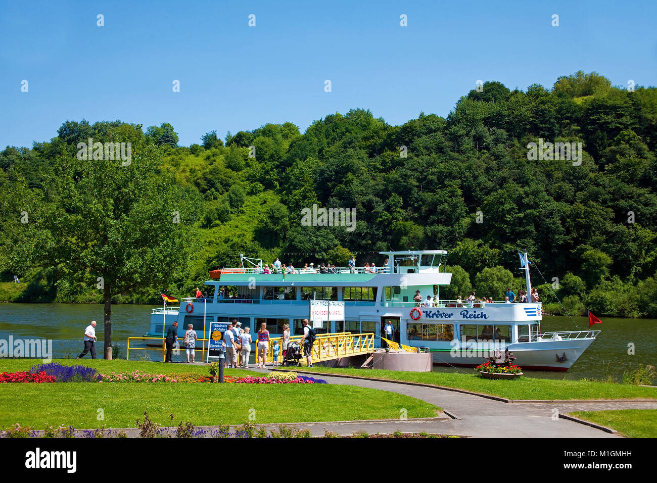 Excursion ship at landing stage of wine village Uerzig, Moselle river, Rhineland-Palatinate, Germany, Europe Stock Photo