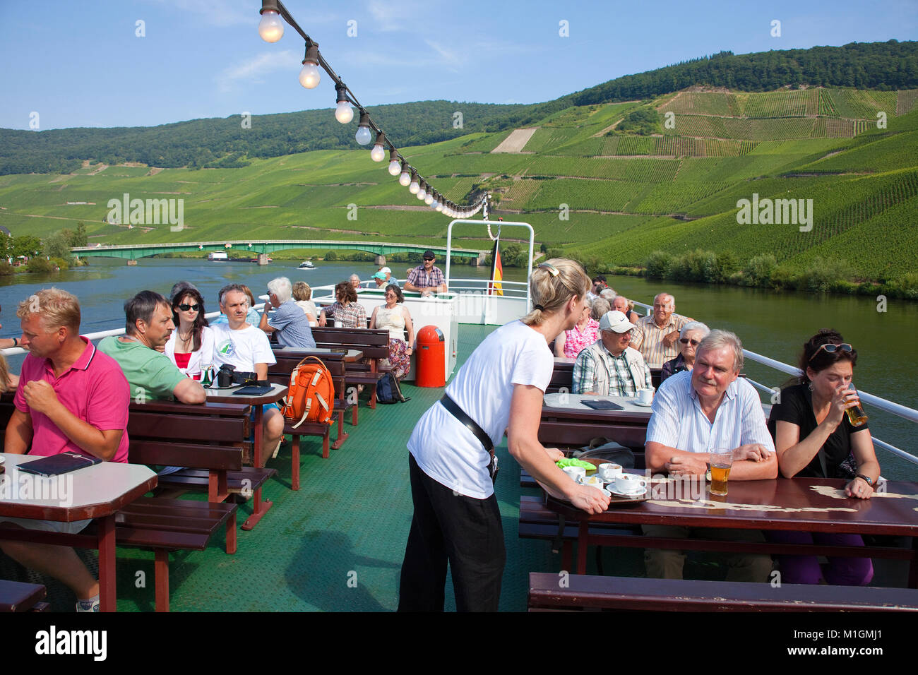 Tourists enjoying a boat trip on Moselle river, Piesport, Moselle river, Rhineland-Palatinate, Germany, Europe Stock Photo