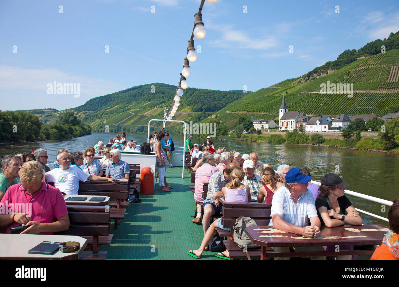 Tourists enjoying a boat trip on Moselle river, Kesten, Moselle river, Rhineland-Palatinate, Germany, Europe Stock Photo