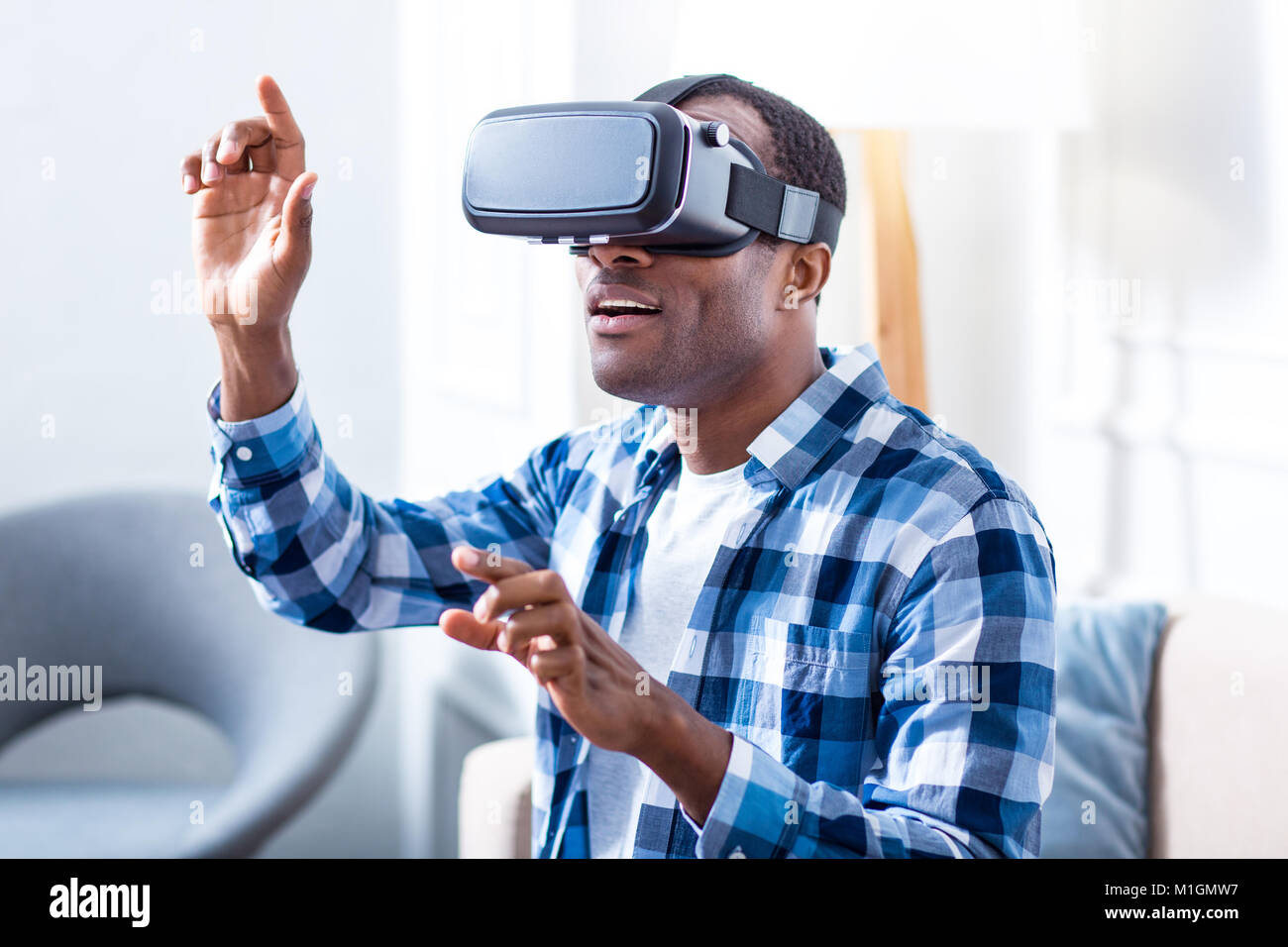 Man Using Testers Positive excited man testing new technology Stock Photo - Alamy