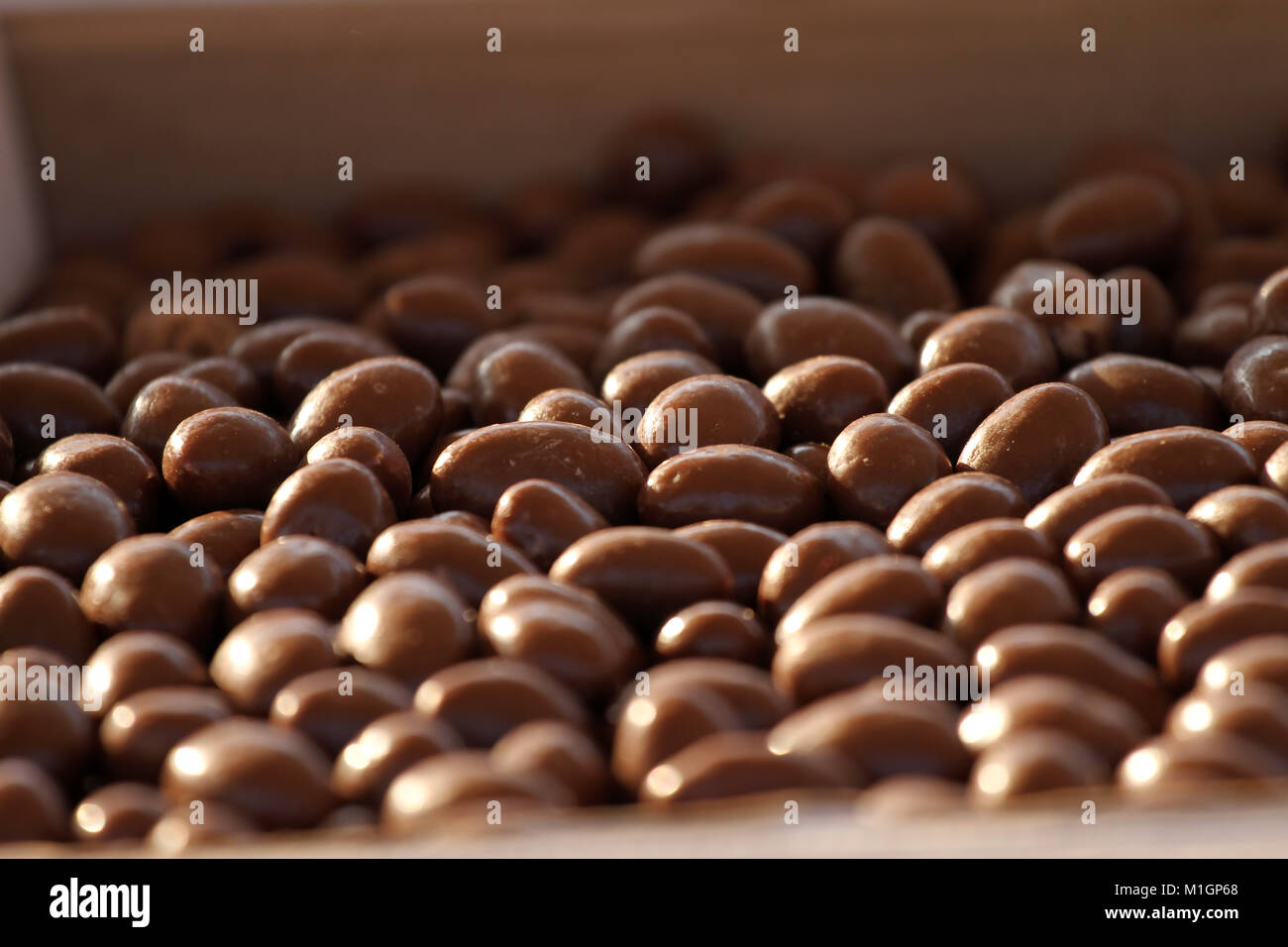 Chocolate nuts. Nuts in chocolate for dessert. Milk chocolate candies