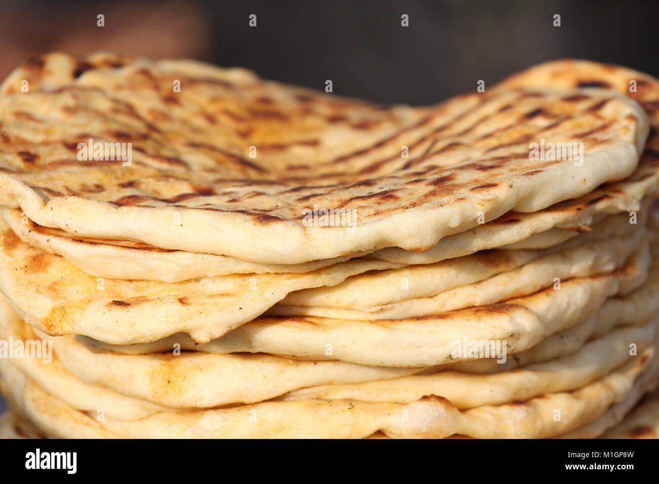 Bread. Pita. Pile of roasted pita, baked flat bread. Heap of focaccia