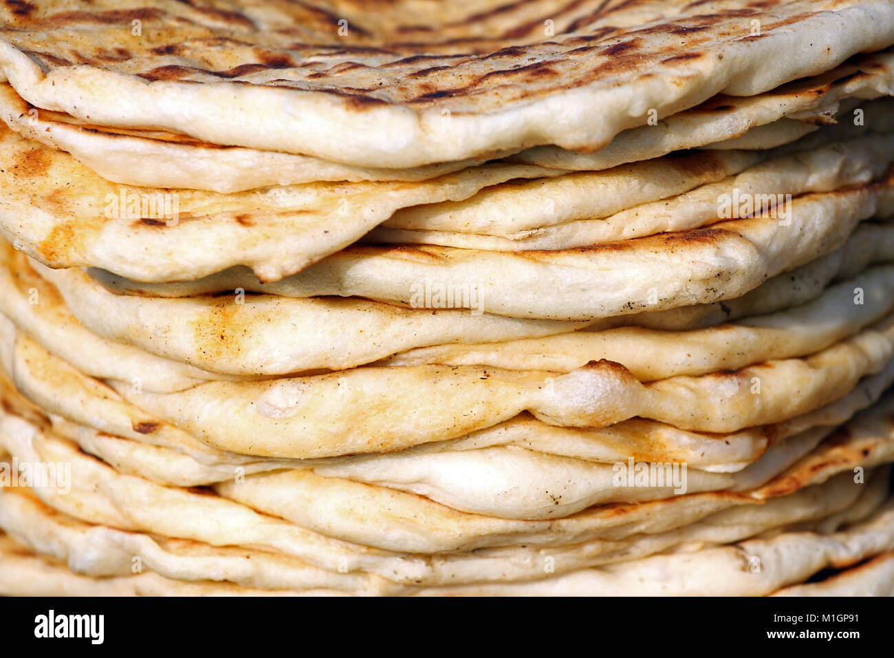 Bread. Pita. Pile of roasted pita, baked flat bread. Heap of focaccia