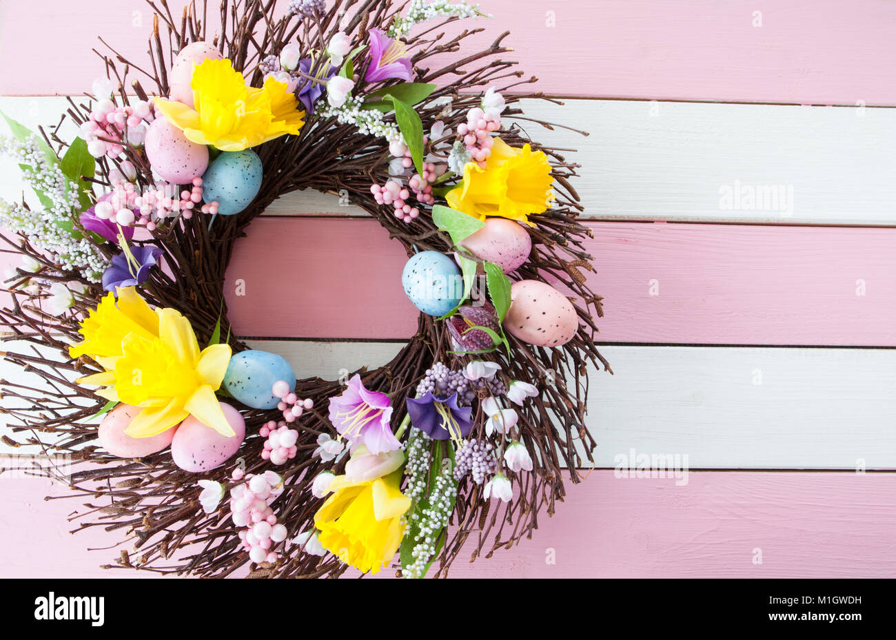 Colorful wreath with flowers and easter eggs Stock Photo - Alamy