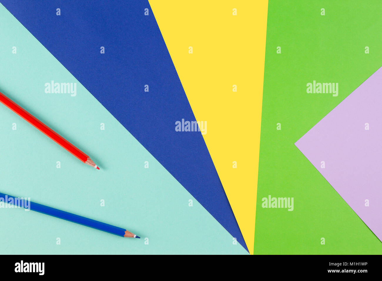 Colored paper with red and blue pencils Stock Photo - Alamy