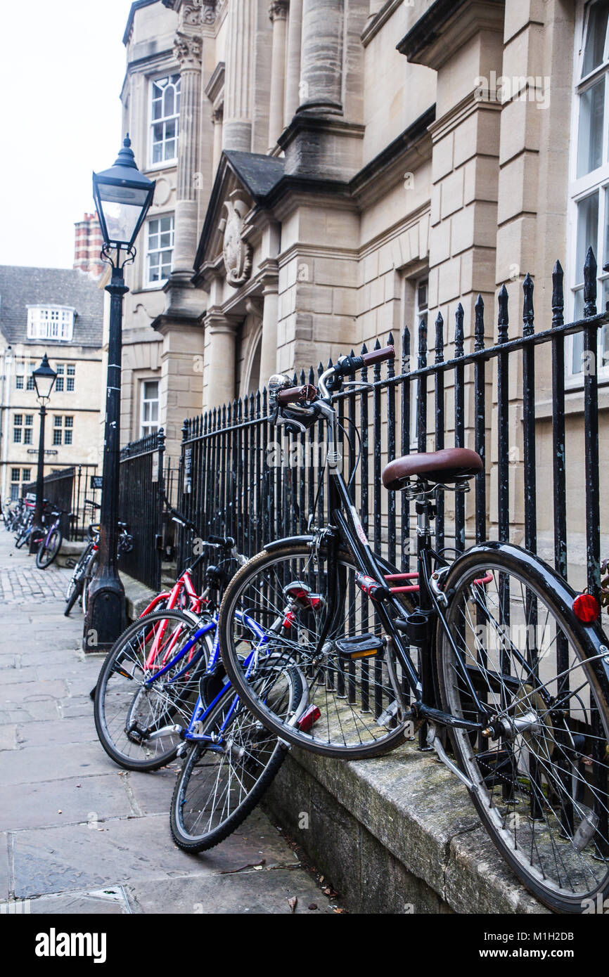 An iconic Oxford scene of push-bikes chained up to railings in outside the university colleges.  September 2017 Stock Photo
