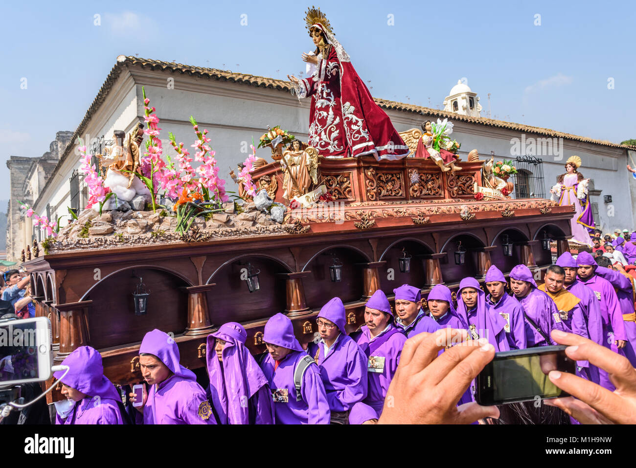 Antigua, Guatemala -  March 24, 2016: Local men carry Virgin Mary in Holy Thursday procession in town with famous Holy Week celebrations Stock Photo
