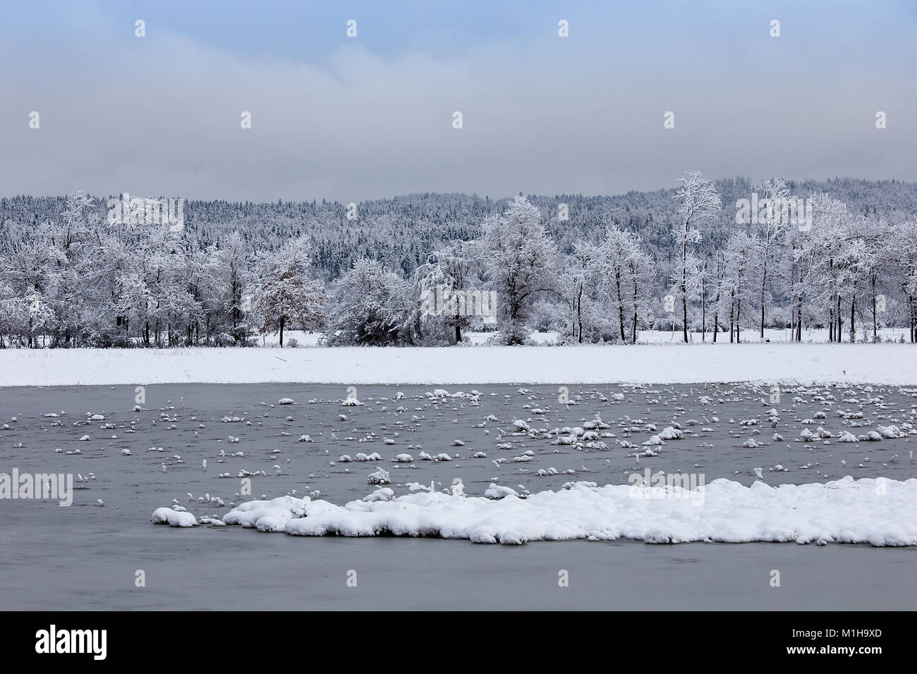 nter landscape background with lake, ice and snow, Planina, Slovenia Stock Photo