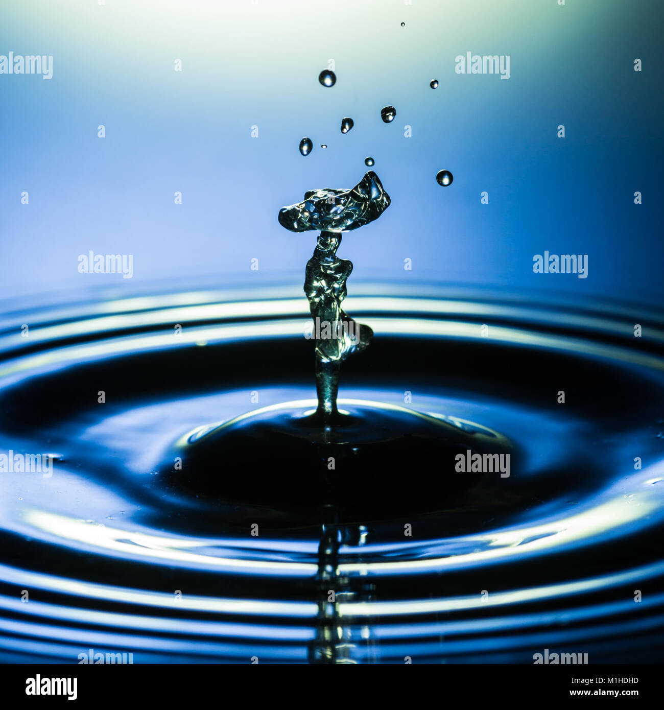 An abstract macro shot of a water drop collision. Stock Photo