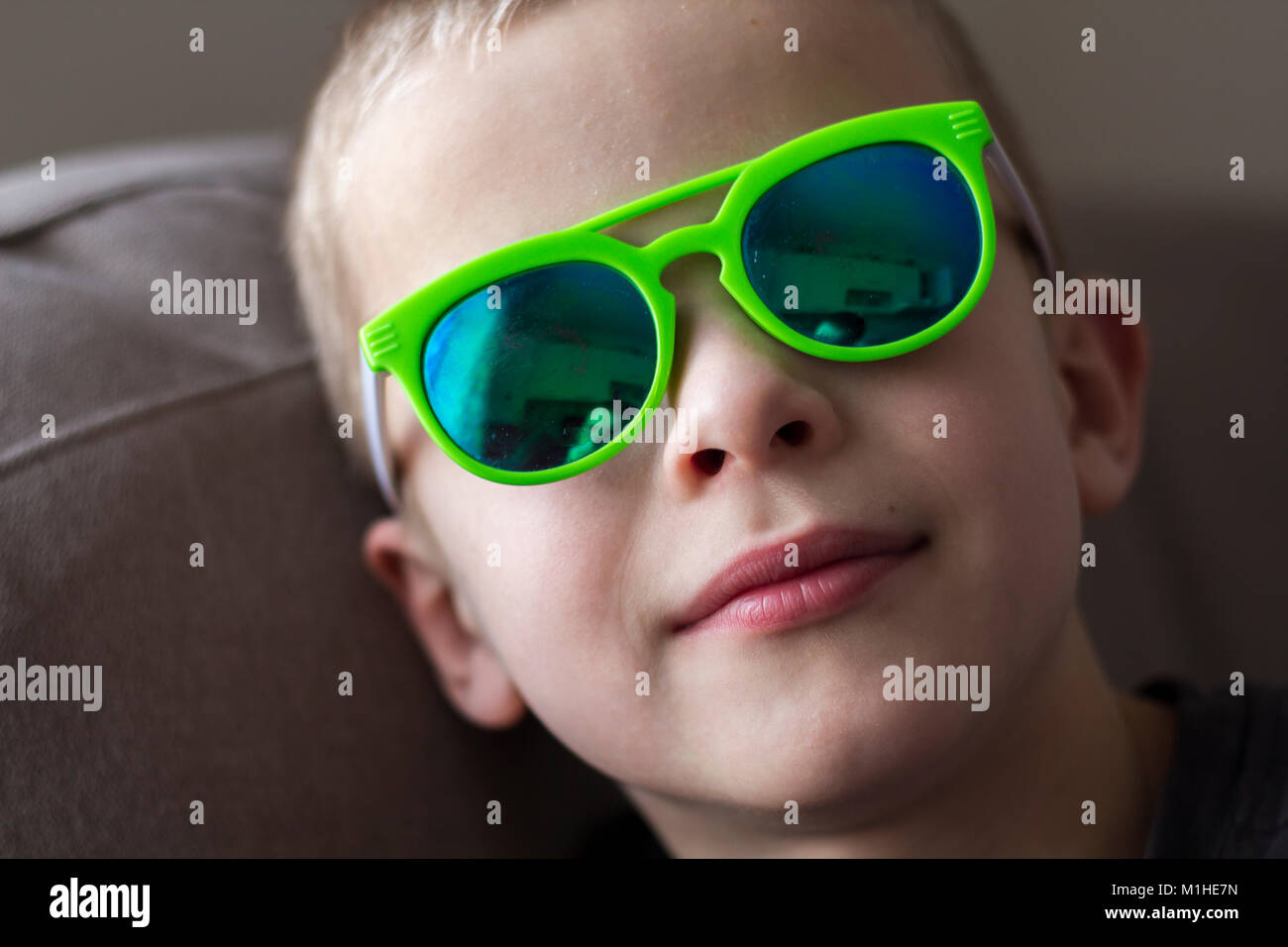 Portrait of a pretty smiling child boy in sunglasses Stock Photo - Alamy