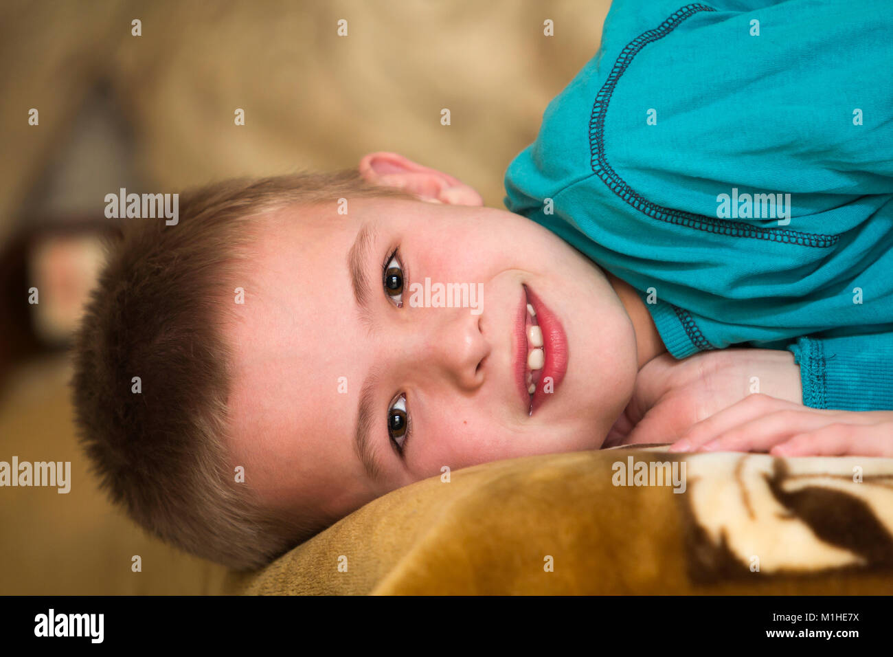 Photo of adorable young happy boy looking at camera Stock Photo - Alamy